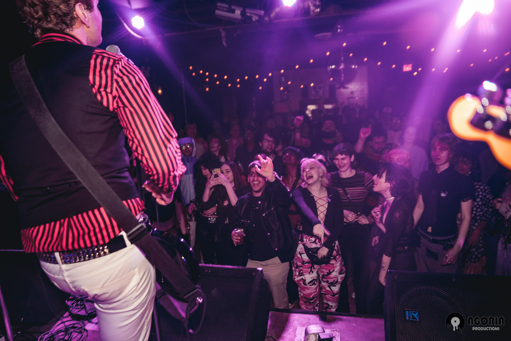 Fluffio playing with The RPC in front of a packed crowd in toronto