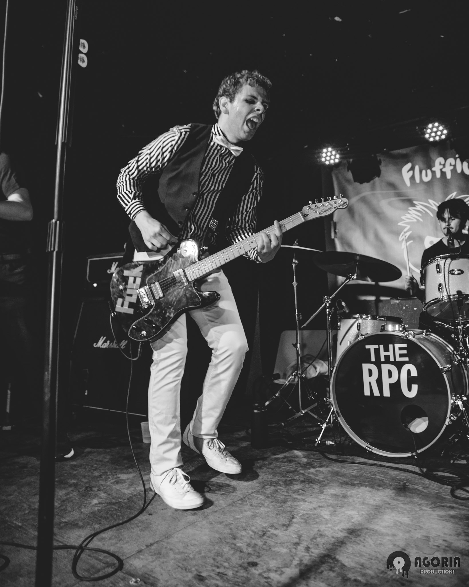 Fluffio performing live at the baby g in toronto screaming while playing guitar black and white