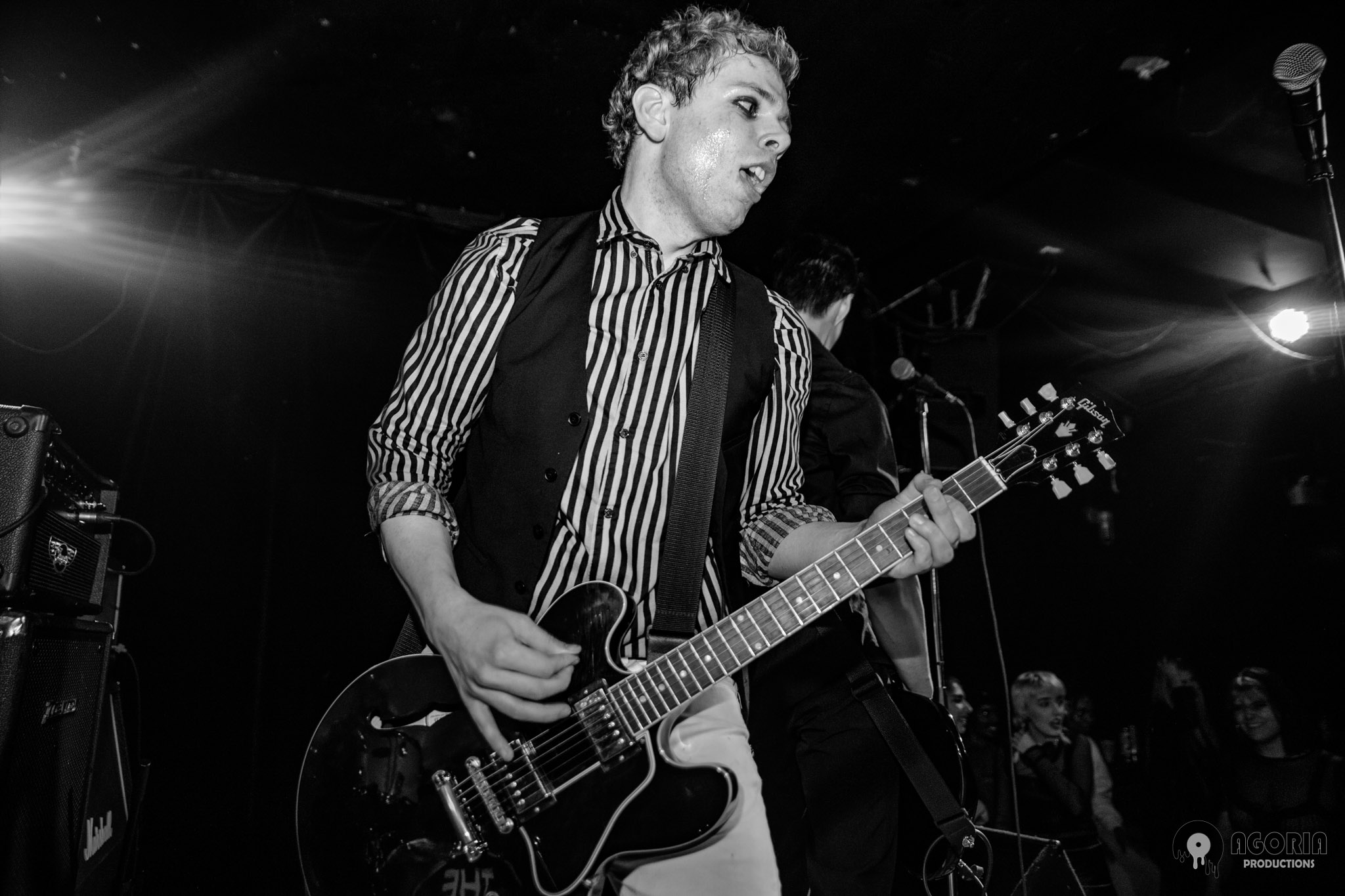 Fluffio playing guitar live at the baby g in toronto black and white