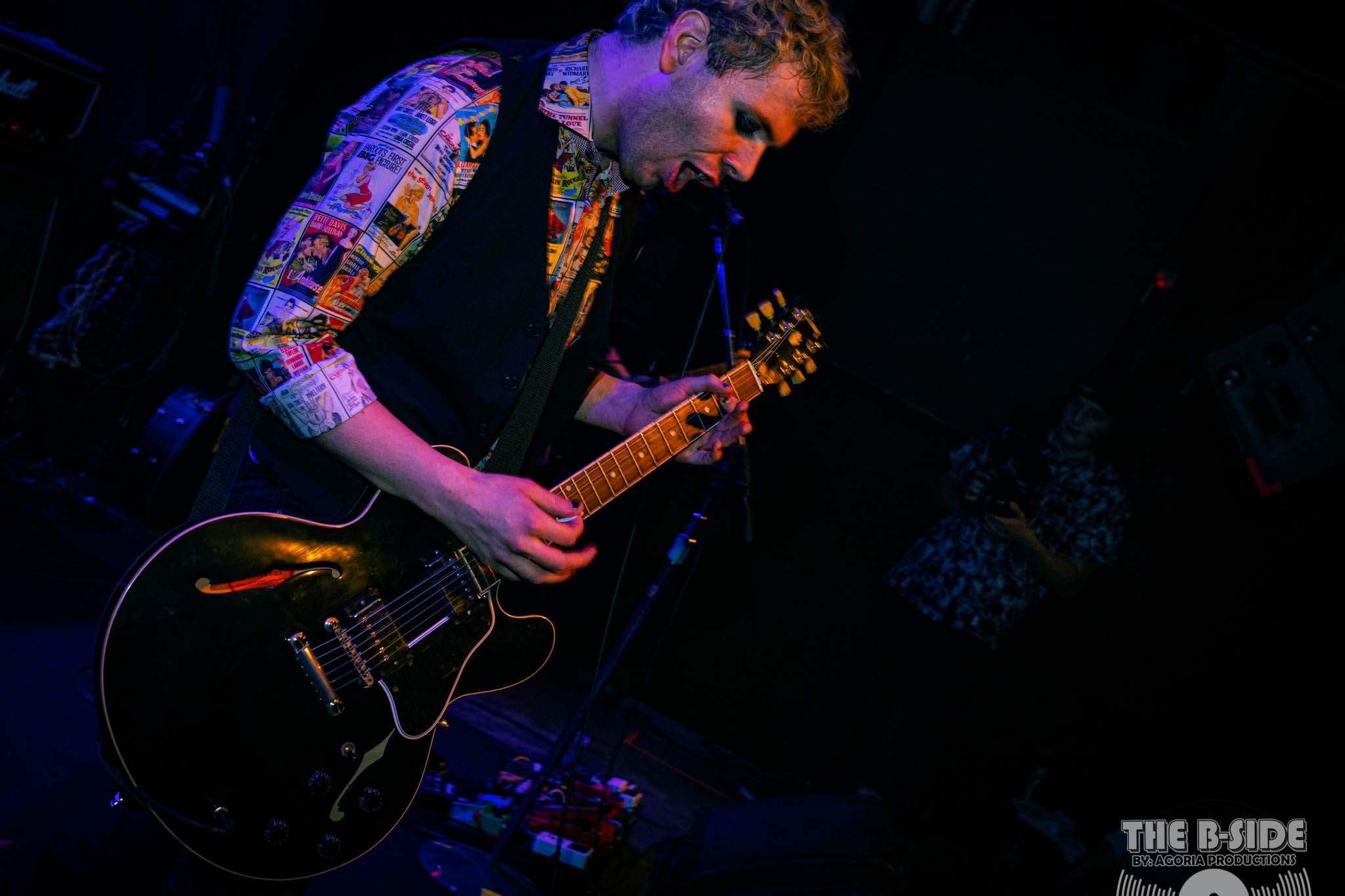 Fluffio playing Guitar on stage mouth open Lee's Palace Torontoi