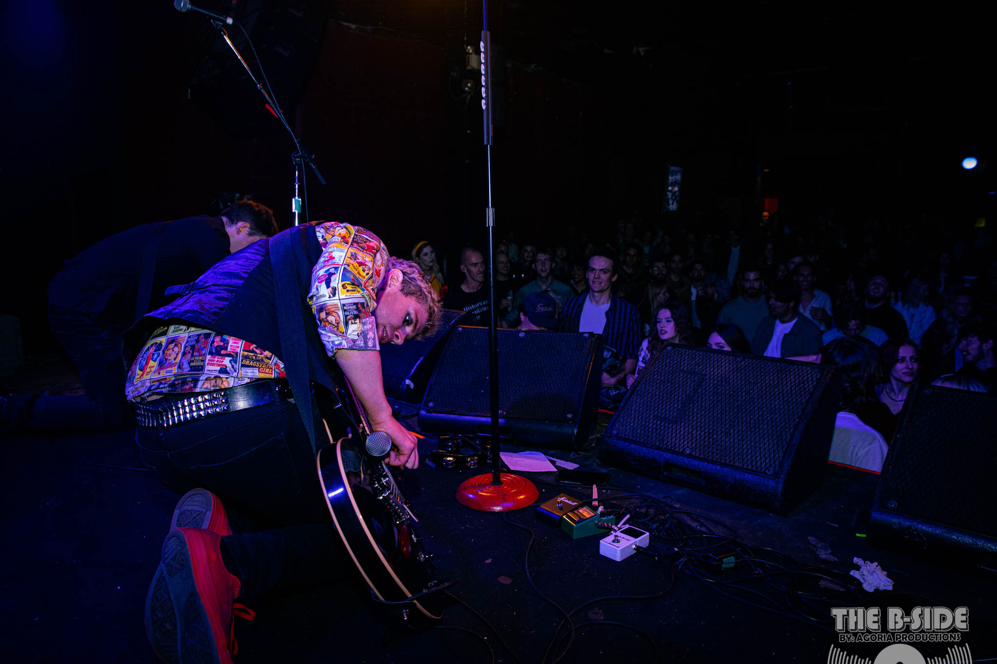 Fluffio shredding guitar with microphone down load on stage at Lee's Palace in Toronto