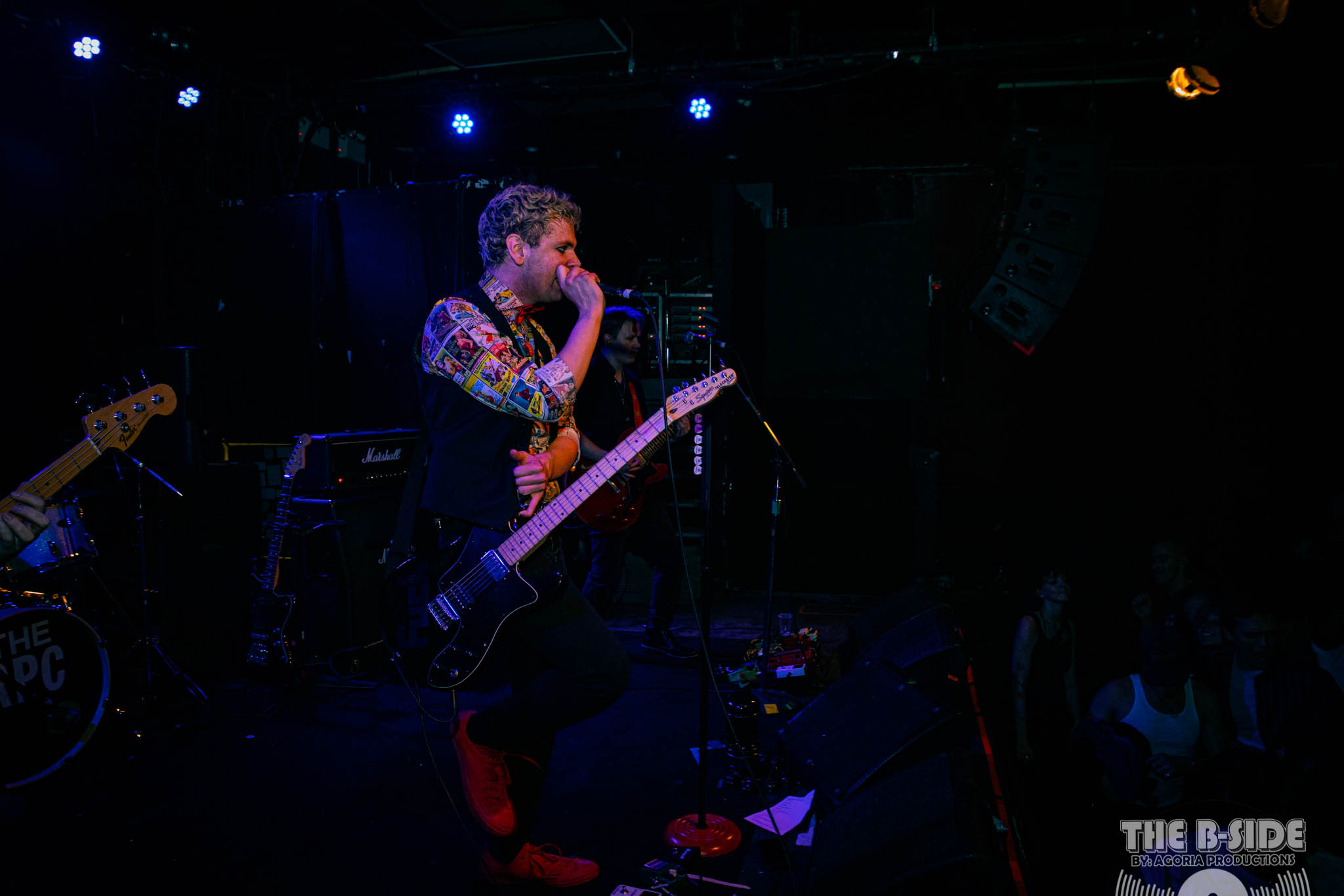 Fluffio running on stage with microphone in hand at Lee's Palace in Toronto wearing red shoes