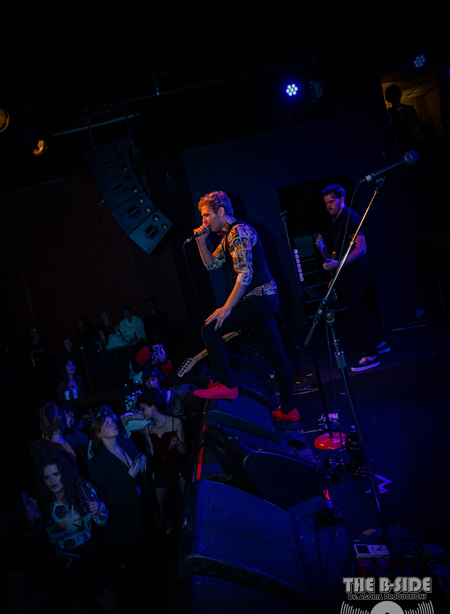 Fluffio & The RPC playing live at Lee's Palace holding micrphone 